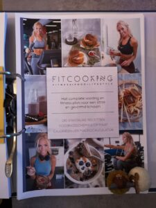 Op de voorkant zie je de voorkant van het boek Fitcooking editie 2